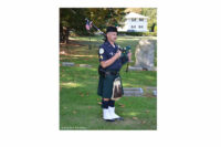 A piper at the scene of the recent Camden memorial service.