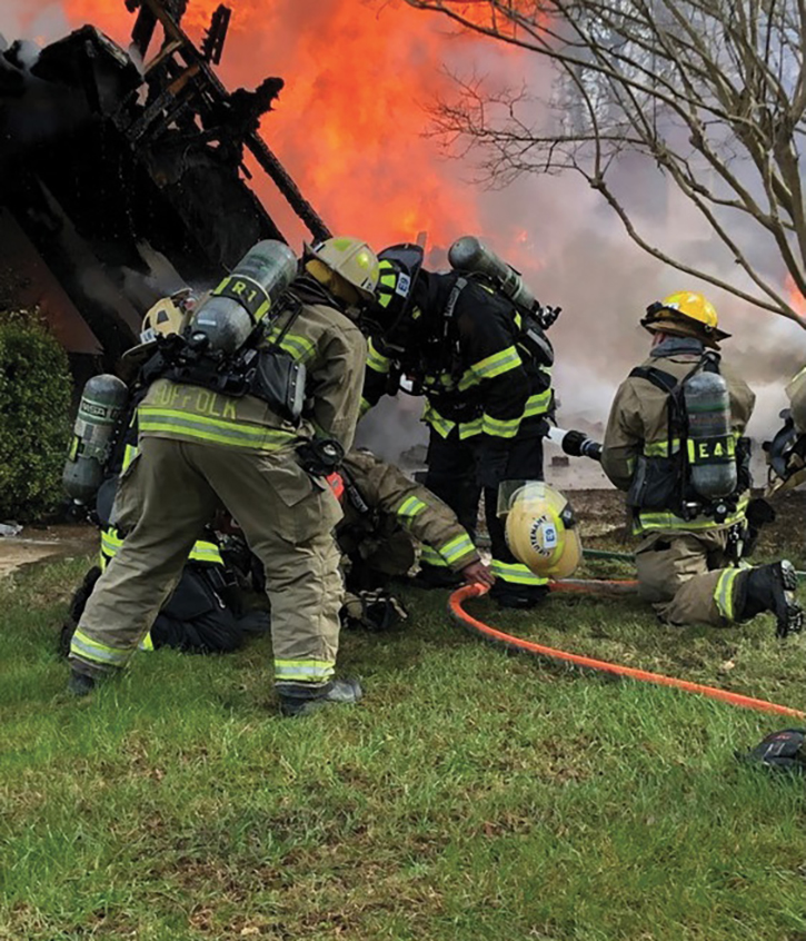 The lieutenant is moved from the collapse to the yard for assessment and treatment.