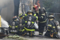 Firefighters working at the scene of a warehouse fire in Indianapolis, Indiana.