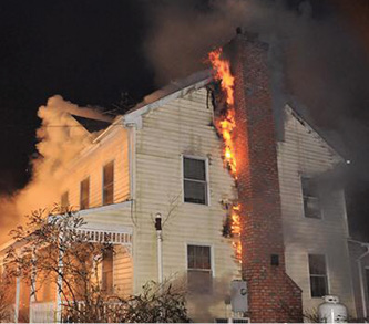 A chimney fire penetrates the liner and extends to the structure. (Photo courtesy of Steven Roth.)