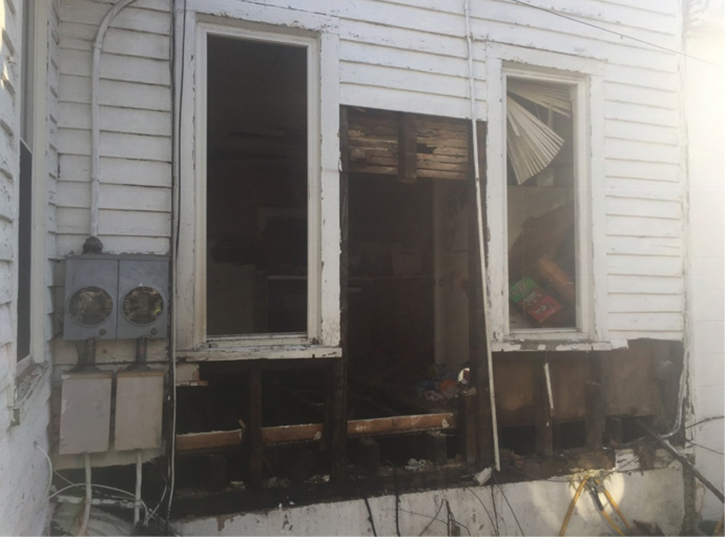 The exterior lap siding was then removed with chain saws to gain access. The reach of the stream from the second line on the exterior successfully knocked down the fire once the free-flowing natural gas was shut off. 