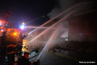 Multiple hose streams in use at the fire