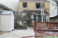 Chicago firefighters work on a down member