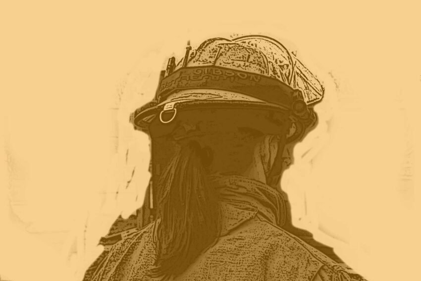 Firefighter with a ponytail in a fire helmet