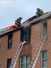 Firefighters on the roof and inside the apartments