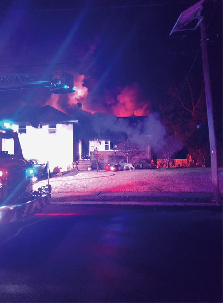 Initial conditions of the A side of the structure. Thick, black smoke is visible along the entire A side soffit, and a glow can be seen from the C side of the structure.