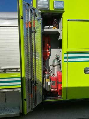 Firefighting gear including hooks and cans inside the fire apparatus