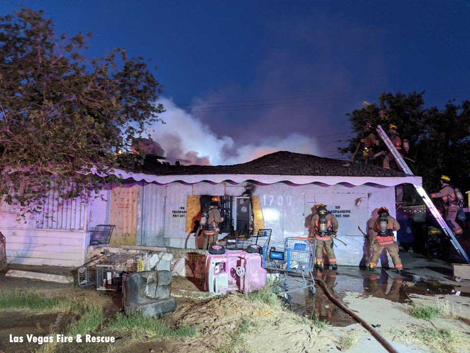 Firefighters operating at the scene of a vacant house fire in Las Vegas, Nevada.