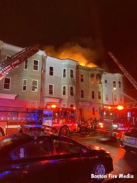 Boston fire apparatus and firefighters arrayed at the scene