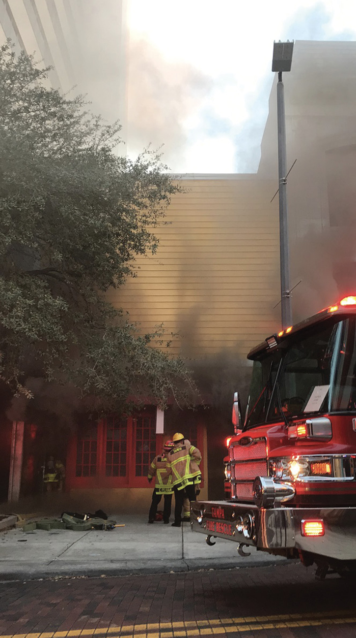 Smoke conditions five minutes after arrival. Compared to photo 2, these conditions had greatly decreased and continued to change repeatedly until the fire eventually broke through the roof. 