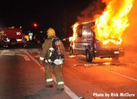 Firefighter facing an ambulance fire