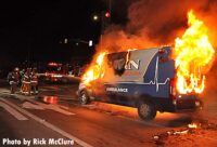 Firefighters get water on the ambulance fire