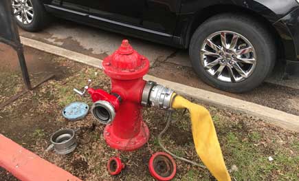 Hose hooked up to a hydrant