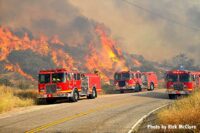 Fire trucks near wildland fire in California