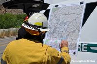 Firefighter examining map