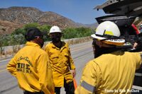 Firefighters confer at the Photos: Tujunga Fire