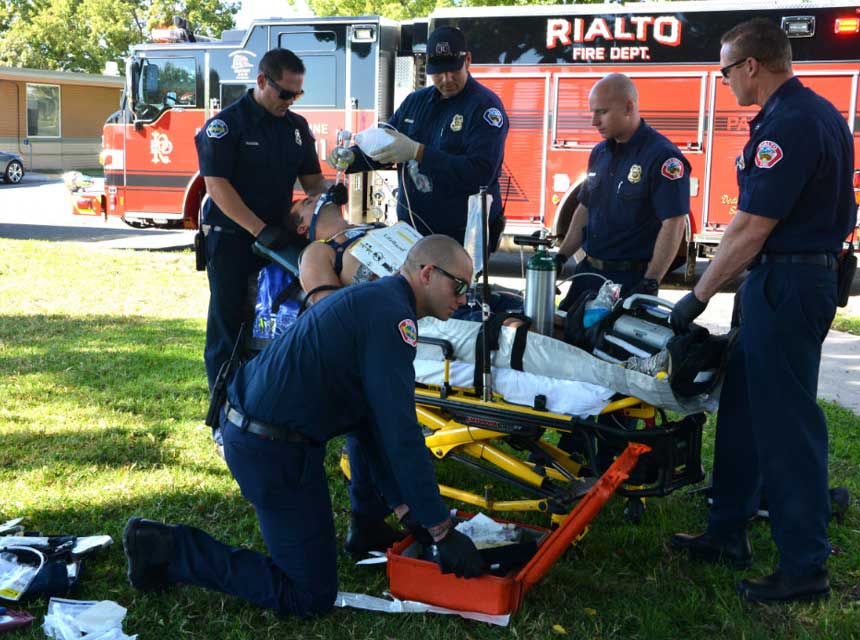 Rialto Fire Department members outside ambulance