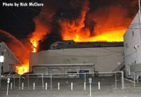 Flames rises from a building under construction in East L.A.