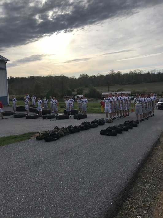 Recruit Class 27 preparing to begin their morning O2X training.