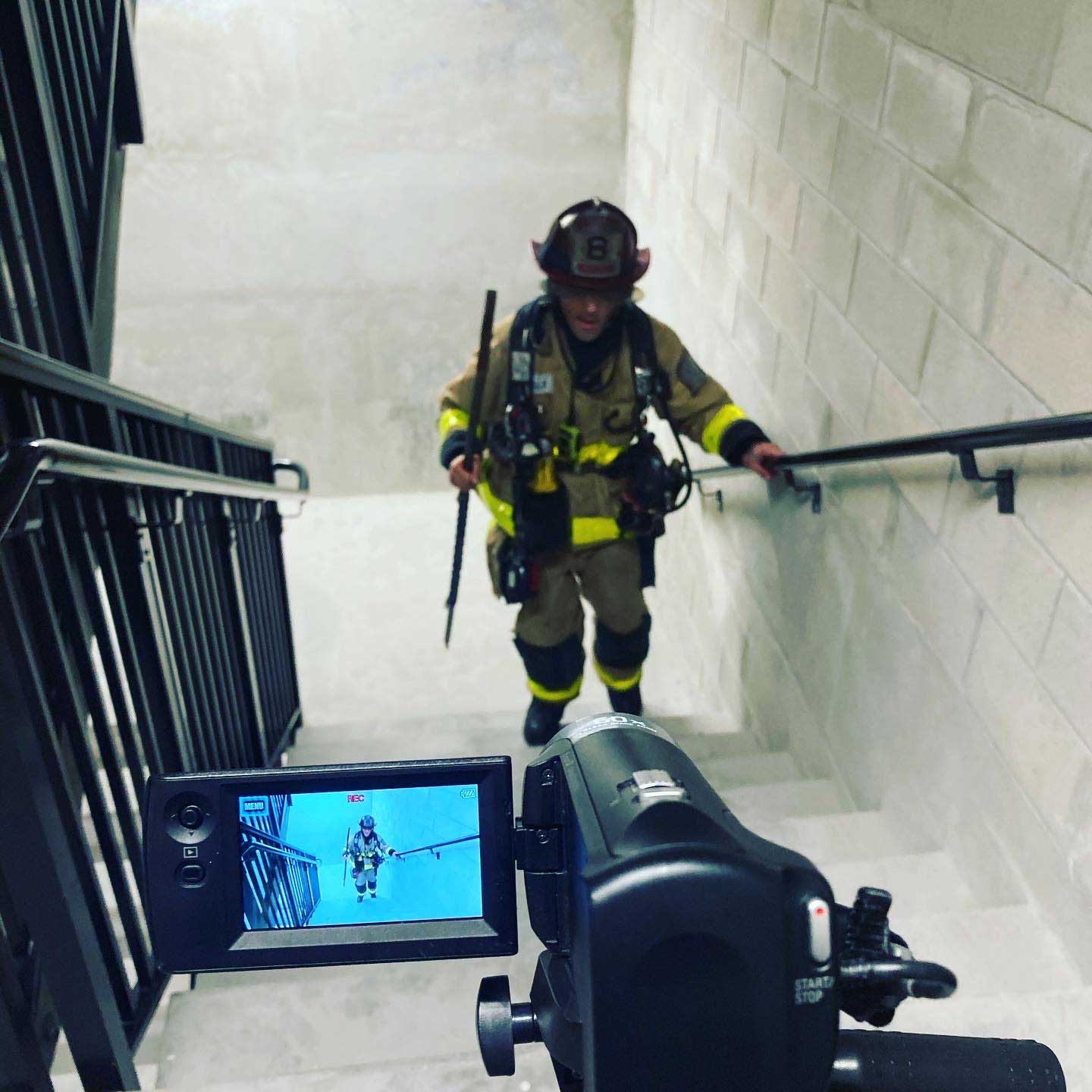 Filming a firefighter on the stairs