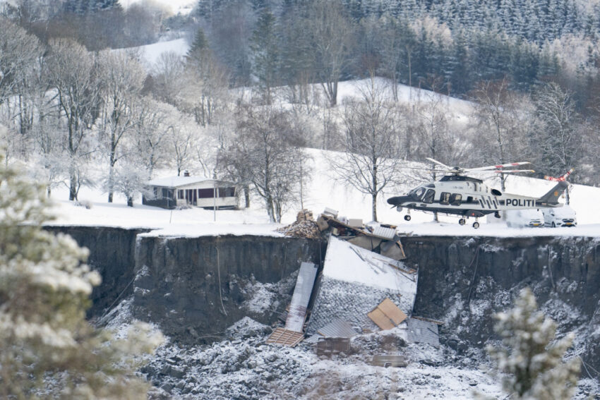 Emergency services near the site of a landslide in Ask, northeast of Oslo, Thursday, Dec. 31, 2020. A landslide smashed into a residential area near the Norwegian capital Wednesday.