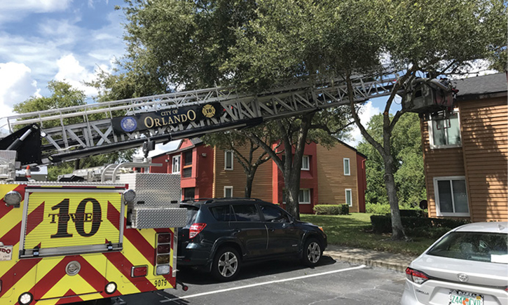 Overhead tree limbs and branches can be removed if the apparatus can’t boom through them to reach the fire building.