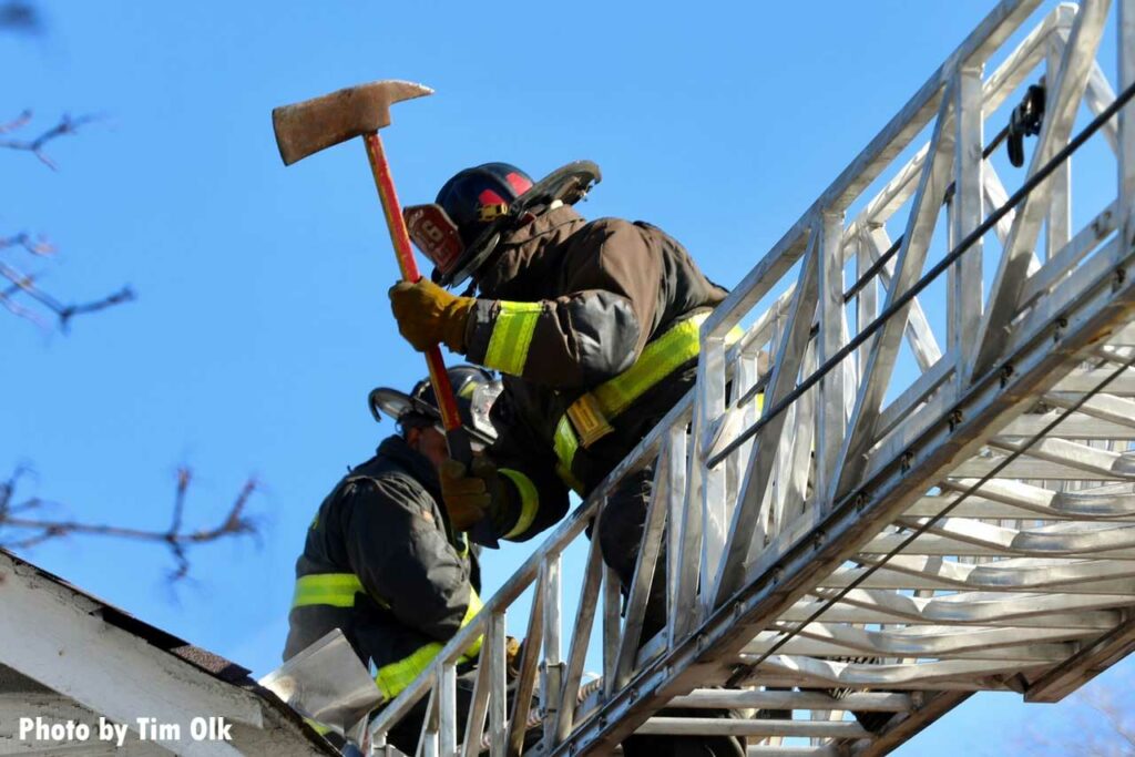 Firefighter on an aerial with an ax in Chicago