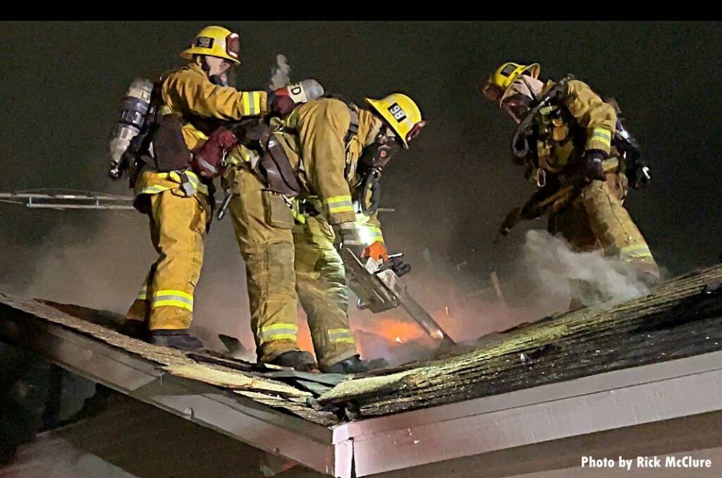 LAFD firefighter makes roof cuts during vertical ventilation