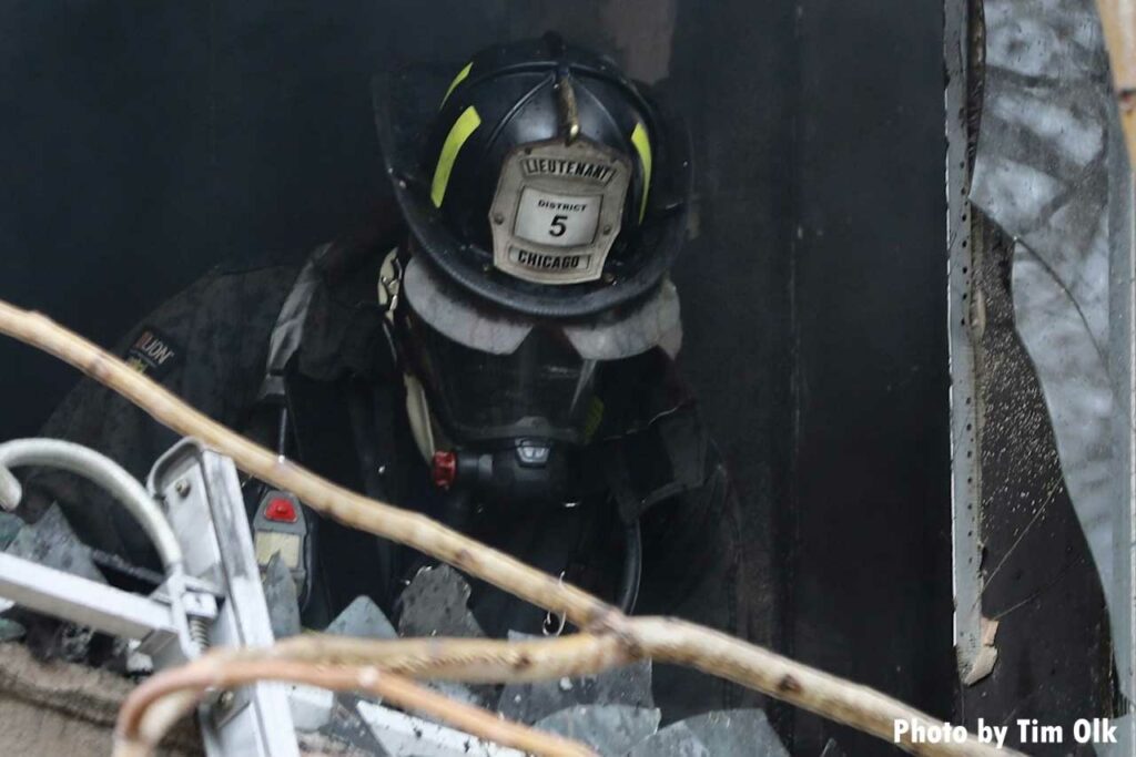 Chicago fire lieutenant in full gear at scene of fire