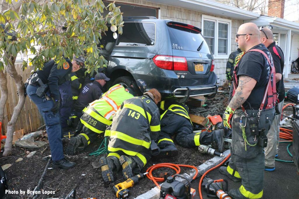 Firefighters respond to car into home on Long Island