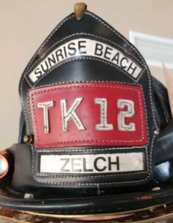 Firefighter helmet shield