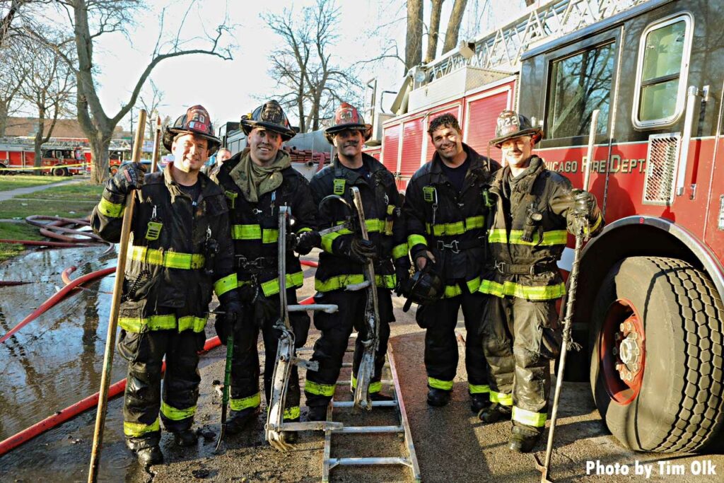 Several Chicago firefighters with equipment at Lafflin fire scene