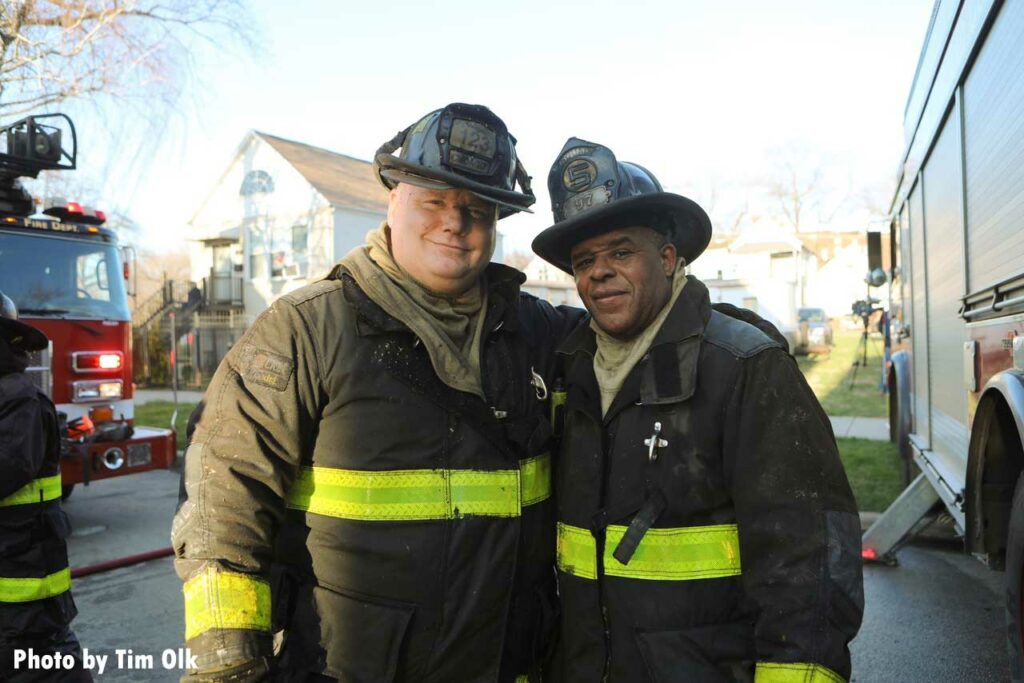 Two Chicago firefighters at fire scene