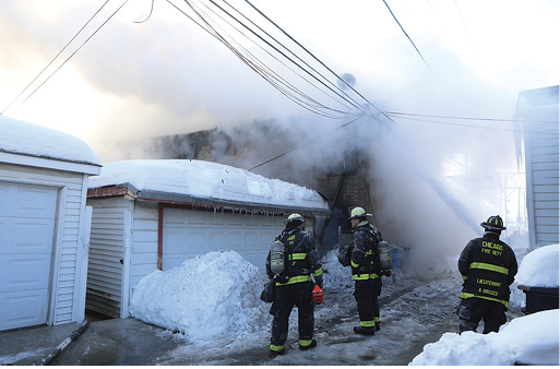 A view from the C/D section of the building with crews using the hoseline defensively. 