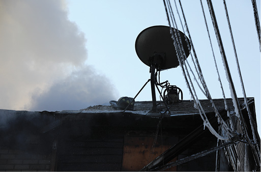 Conditions became so bad so fast that crews had to bail off the roof, leaving behind their equipment and tools.