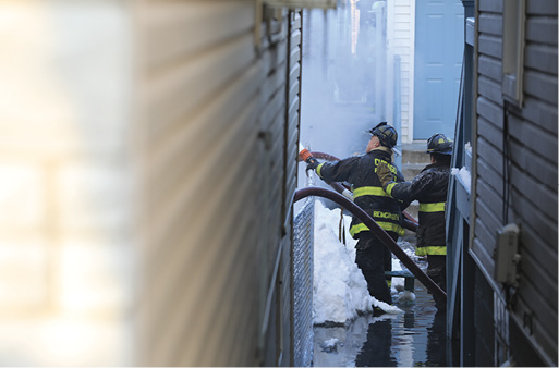 A view from the “gangway” with water now coming up high to the firefighters.