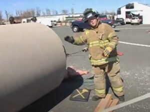 Firefighters use air bag to lift concrete cylinder off victim