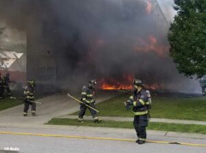 Indianapolis Fire Department firefighters battle garage fire