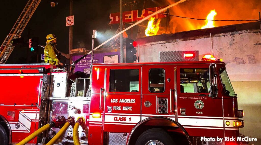 LAFD fire truck with fire shooting from building