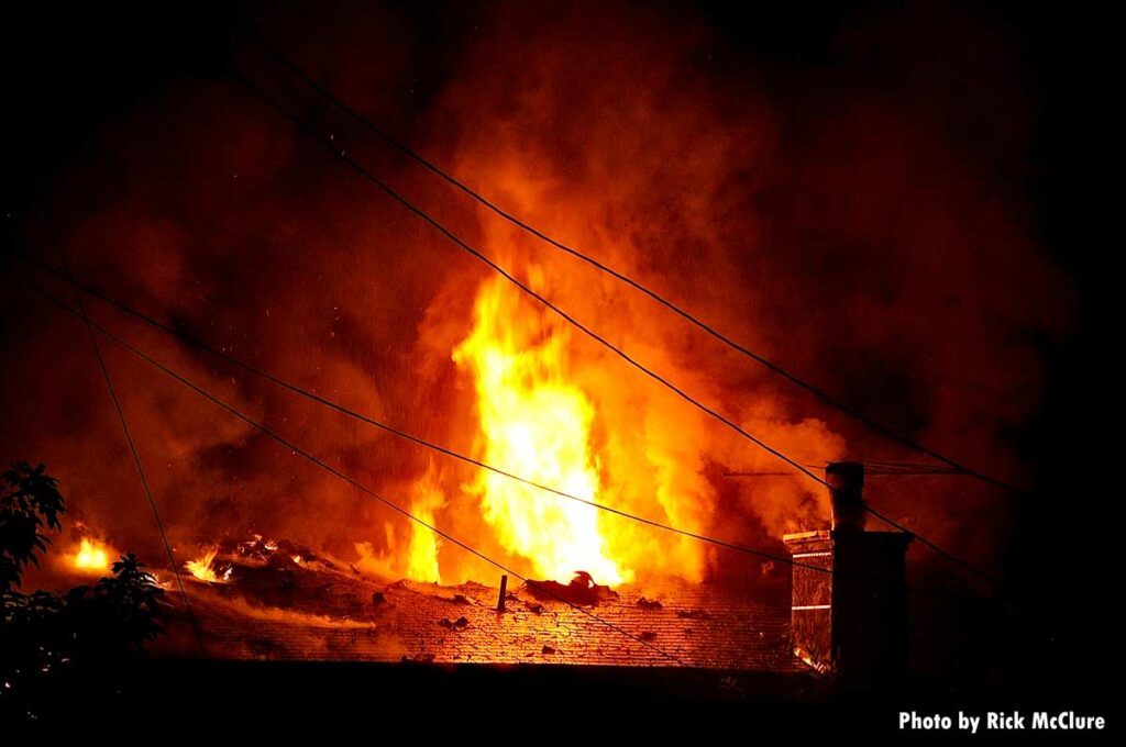 Power lines and fire on roof