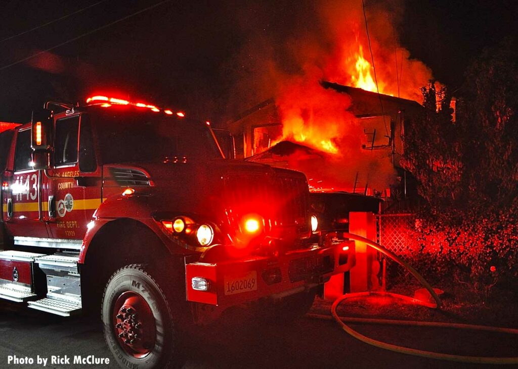 Los Angeles County fire apparatus at burning home