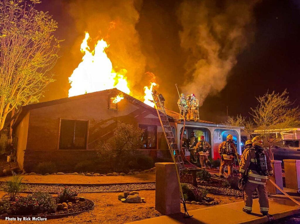 Enormous flames shoot through roof at house fire