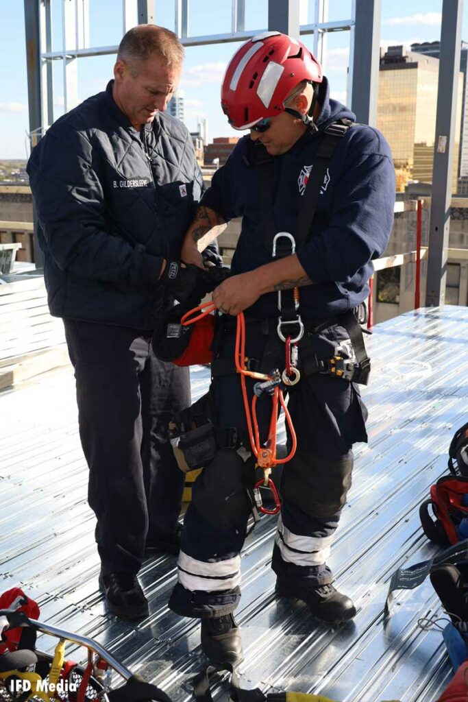 Indianapolis firefighters prepare a rope rescue system