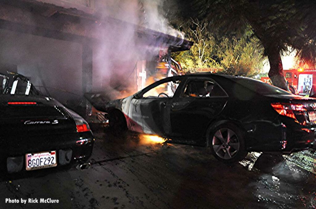 Flames burn beneath a vehicle in Los Angeles