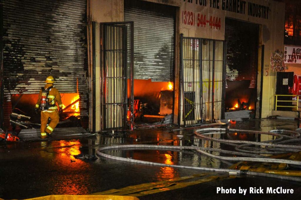 Flames show beneath roll-up doors