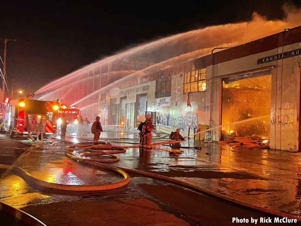 Flames and myriad streams of water at Los Angeles fire