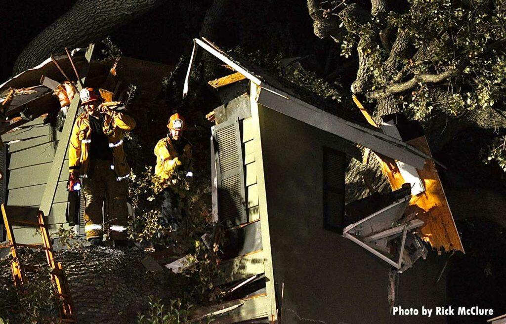 Firefighters inside house crushed by tree