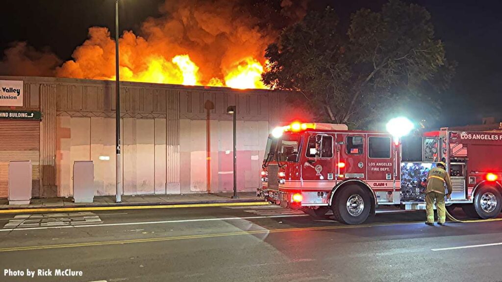 LAFD pumper with firefighter at commercial structure fire