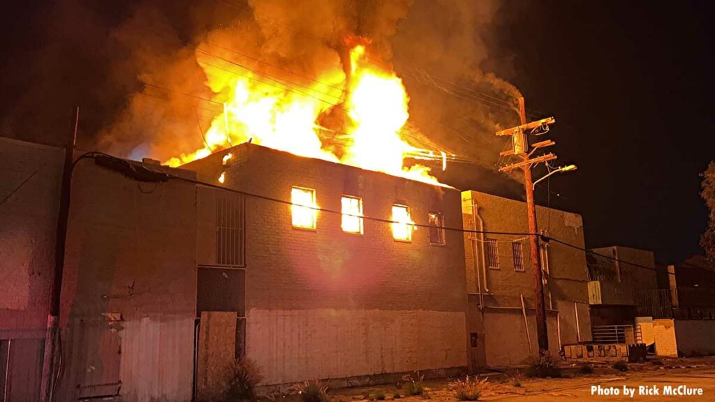 Flames rip through top of building in Los Angeles