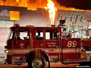 Flames rip through front facade of commercial building in Los Angeles